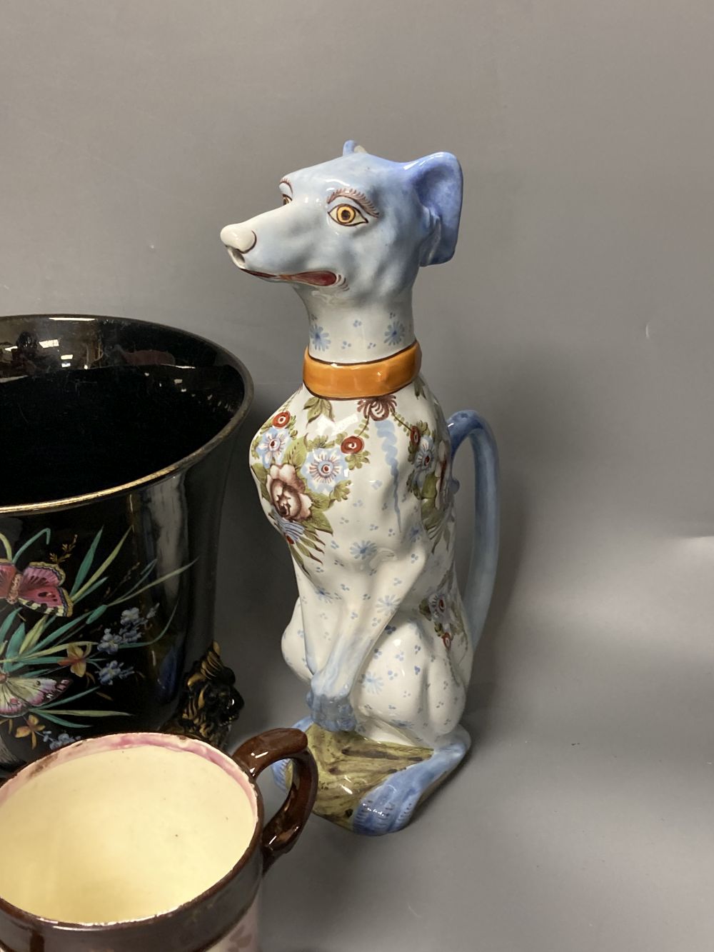 An opaline glass jug, an Edwardian jardiniere, a lustre mug and a novely whippet jug, 29cm